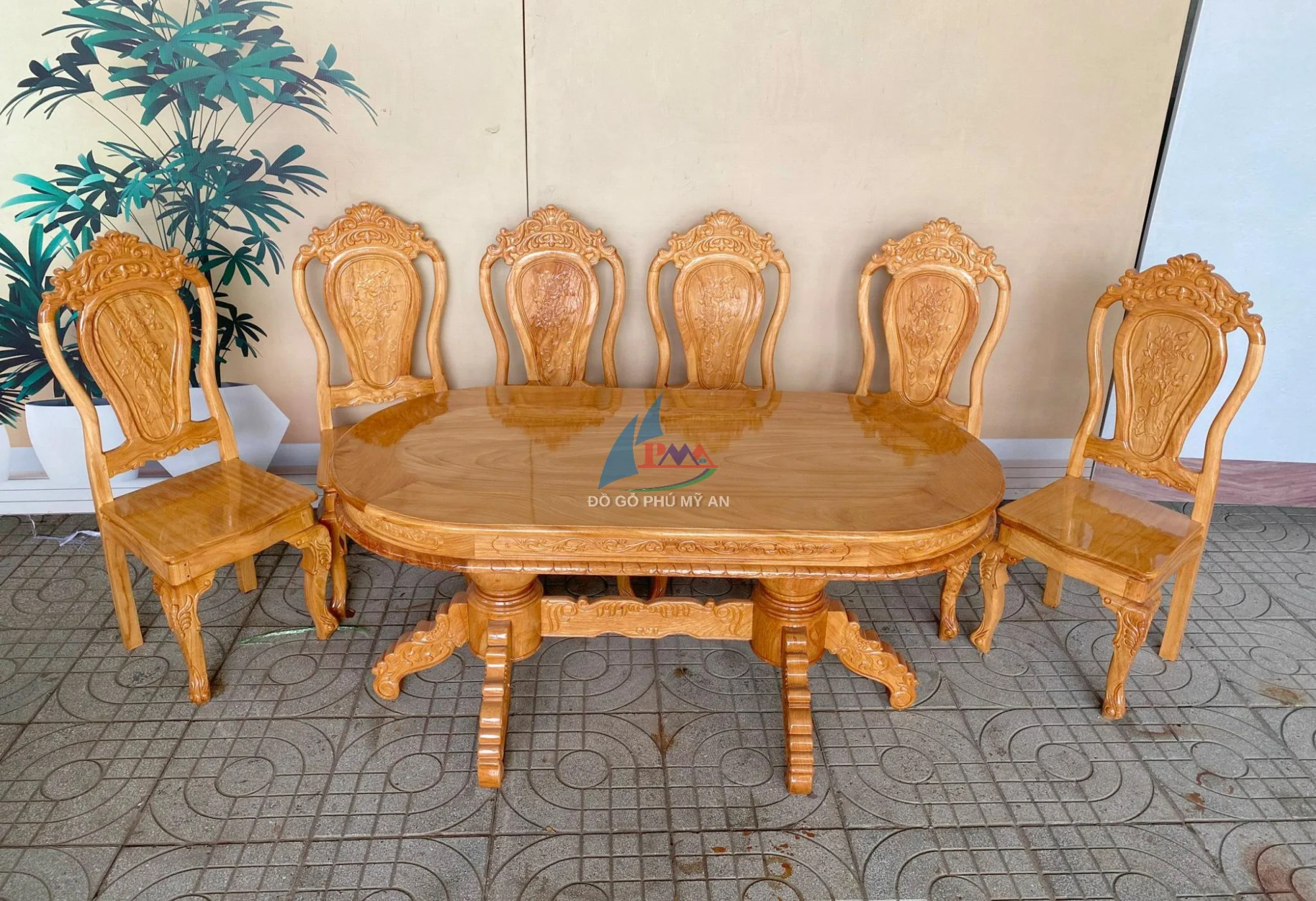 Bàn ăn gõ oval nhỏ